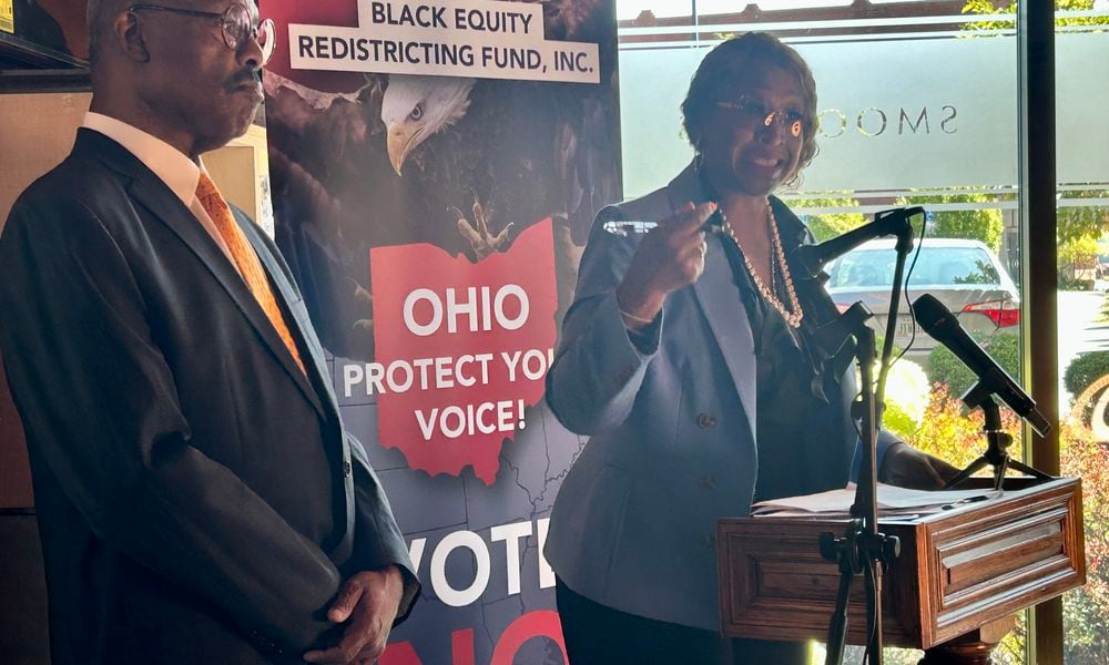 Cleveland Democrat and former Ohio lawmaker John Barnes (left) stands by Detroit Democrat and former Michigan lawmaker Sherry Gay-Dagnogo (right) on Sept. 9, 2024, as the two stump against Issue 1.