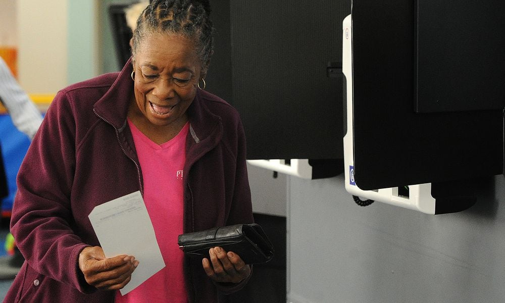 Gloria Payne, 79, casts her ballot on Tuesday Aug. 8 2023 at a Dayton-area polling location. She said she votes in every election because she remembers hearing from her mother about a time where every citizen couldn't vote. MARSHALL GORBY\STAFF