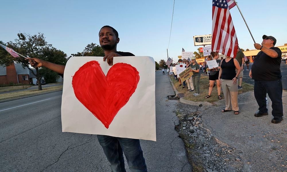 Petuel Jeanjacques, a Haitian immigrant, participates in a Peace Rally at the Clark County Democratic Party on Park Road in Springfield Wednesday, Sept. 18, 2024. BILL LACKEY/STAFF