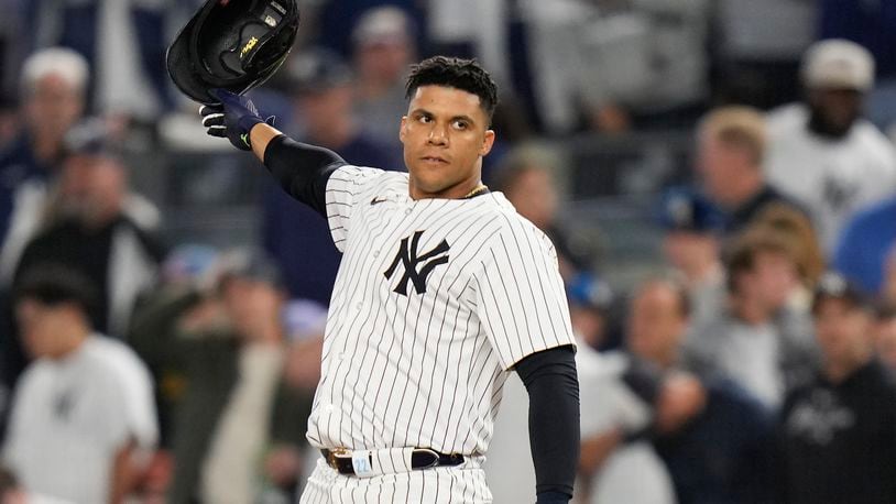 New York Yankees outfielder Juan Soto (22) tosses his batting helmet after flying out against the Kansas City Royals to end the seventh inning of Game 2 of the American League baseball playoff series, Monday, Oct. 7, 2024, in New York. (AP Photo/Seth Wenig)