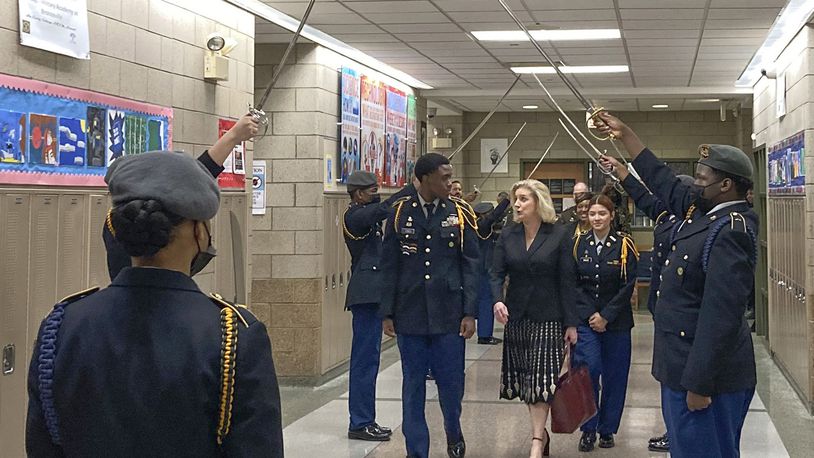 FILE - Army Secretary Christine Wormuth is greeted at the Chicago Military Academy as she heads into meetings with young members of the Reserve Officers' Training Corps in Chicago, on Feb. 15, 2023. The Army and Air Force say they are on track to meet their recruiting goals in 2024, reversing previous shortfalls using a swath of new programs and policy changes. But the Navy, while improving, expects once again to fall short. (AP Photo/Lolita Baldor, File)