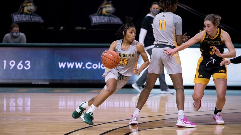 Wright State's Angel Baker (15) comes off a screen set by teammate KK White during Friday's Horizon League win over Milwaukee. The Raiders beat the Panthers again on Saturday. Joseph Craven/Wright State Athletics