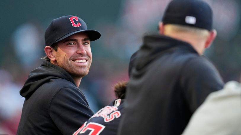 Cleveland Guardians' Shane Bieber stands in the dugout during the third inning of a baseball game against the Los Angeles Angels in Anaheim, Calif., Saturday, May 25, 2024. (AP Photo/Ashley Landis)