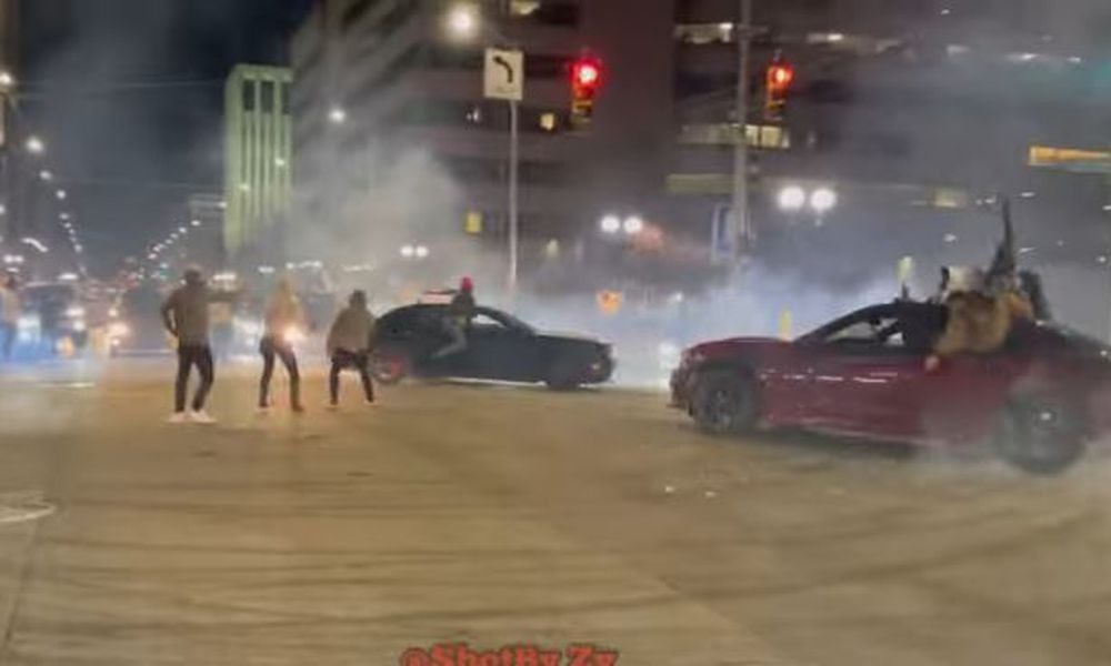 Cars do donuts and drive in circles at East Third Street and Jefferson Street in downtown Dayton over the weekend. YOUTUBE