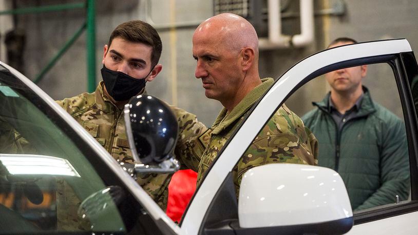 Chief Master Sgt. David Flosi (center), Air Force Materiel Command command chief, listens as Senior Airman Paiden Carlisle, 88th Security Forces Squadron vehicle control officer, describes how unit capabilities can integrate with future technology such as the android tactical assault kit on March 10 at Wright-Patterson Air Force Base. ATAK enhances command and control during emergency situations and allows for multiagency integration. U.S. AIR FORCE PHOTO/JAIMA FOGG