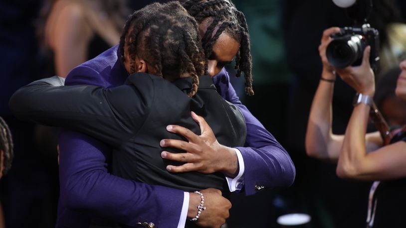 DaRon Holmes hugs his brother Cameron after being selected with the No. 22 pick in the NBA Draft on Wednesday, June 26, 2024, at the Barclays Center in Brooklyn, N.Y. David Jablonski/Staff