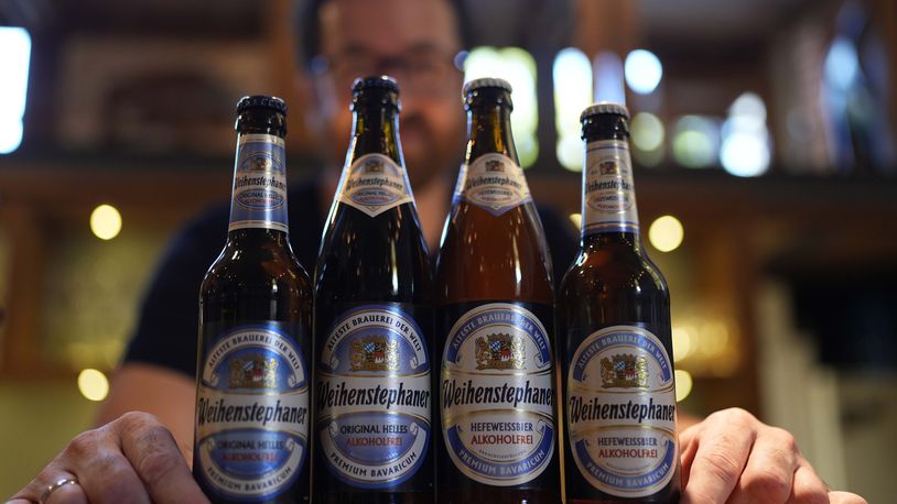 Head Brewmaster Tobias Zollo poses behind non alcoholic beer at the Weihenstephan brewery in Freising, Germany, Friday, Sept. 20, 2024. (AP Photo/Matthias Schrader)