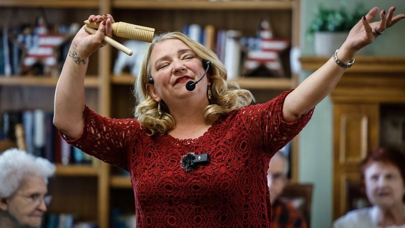 Community Gem Krissy O'Malley sings and dances with the residence of Brookdale Centennial Park Senior Living. O'Malley is the owner and founder of Senior Music Connection. JIM NOELKER/STAFF