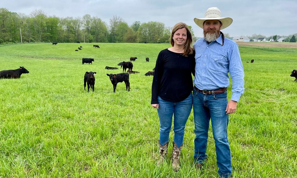 Honey Creek Beef is a closed herd cattle farm located at 6350 Addison-New Carlisle Road, just outside of Champaign County in New Carlisle. Pictured are owners Adam Frantz and his wife, Mia Grimes. NATALIE JONES/STAFF