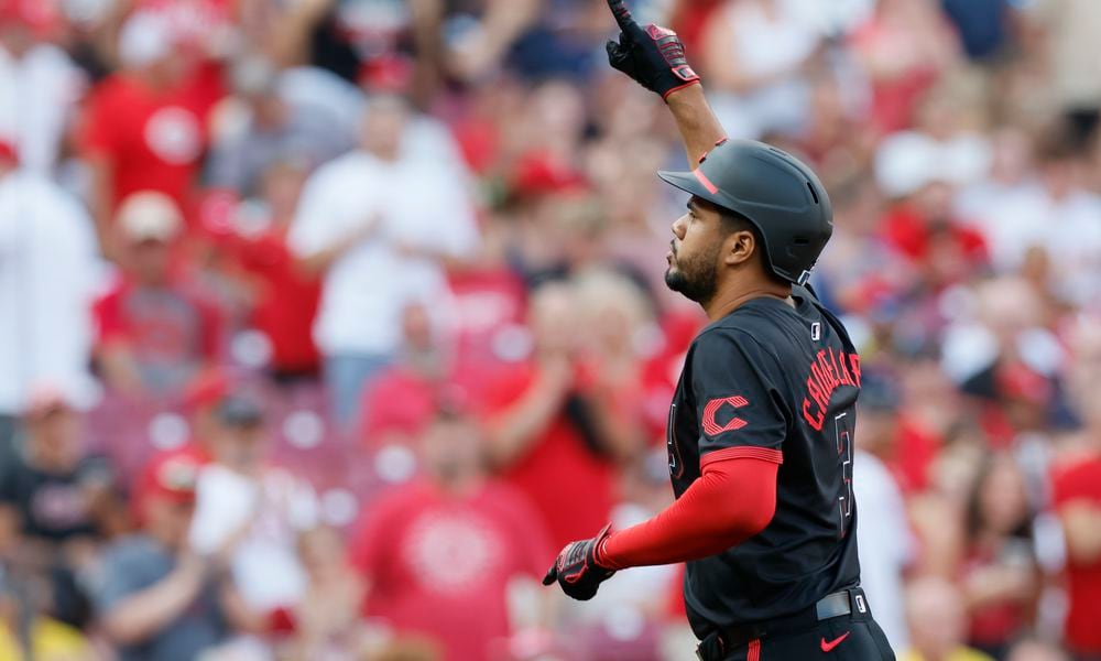 Cincinnati Reds' Jeimer Candelario celebrates his home run against the Boston Red Sox during the first inning of a baseball game Friday, June 21, 2024, in Cincinnati. (AP Photo/Jay LaPrete)