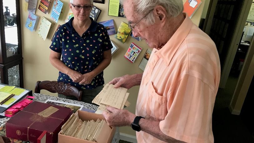 With daughter Beverly Rutan looking on, Walter Stitt looks at one of the 82 letters (the rest are in the hat box in front of him) he wrote during World War II to his mother who was living in West Virginia. Some of his letters were penned when he was in basic and advanced training at Camp Polk, Louisiana and the rest came as he served in Sherman tanks in France, Belgium and Germany. He was in some of the war’s deadliest battles: the Battle of Normandy and the Battle of the Bulge. Twice his tank commanders and others alongside him in tanks were killed by German shells. He received two Purple Hearts; the National Order of the Legion of Merit, the highest honor of France; and the Order of Saint George Medallion, the top award given to members of the Army's mounted force (tanks, cavalry) by the United States Armor Association of the United States Army. Tom Archdeacon/CONTRIBUTED
