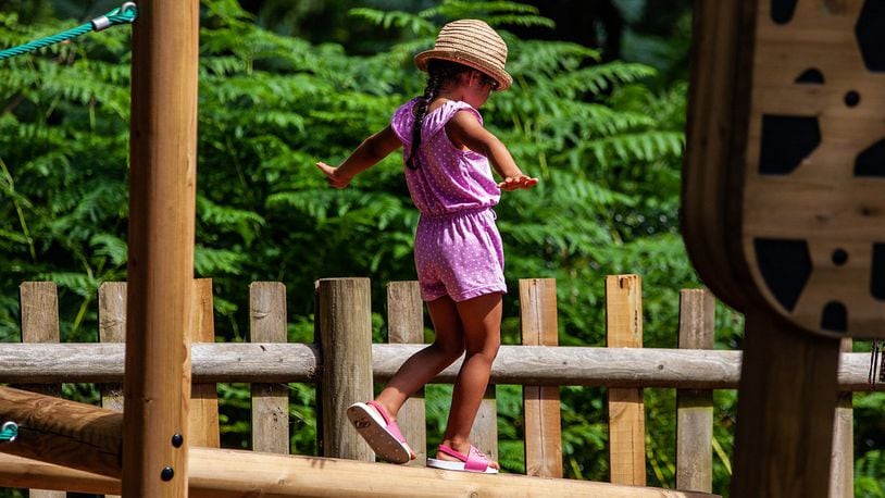 A little girl carefully walks across a log. A Texas school district is investigating how a 4-year-old girl managed to leave an elementary school and walk home in the middle of the day, shocking her mother when she appeared at the front door.