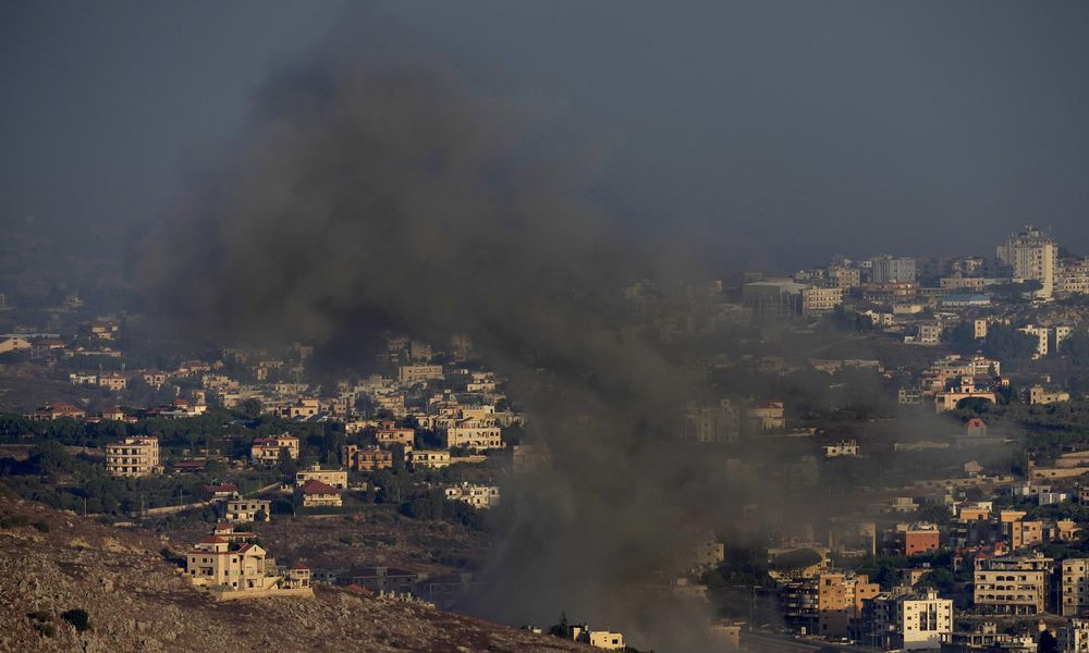 Smoke rises from an Israeli airstrike on Kfar Rouman village, as seen from Marjayoun town, south Lebanon, Monday, Sept. 23, 2024. (AP Photo/Hussein Malla)