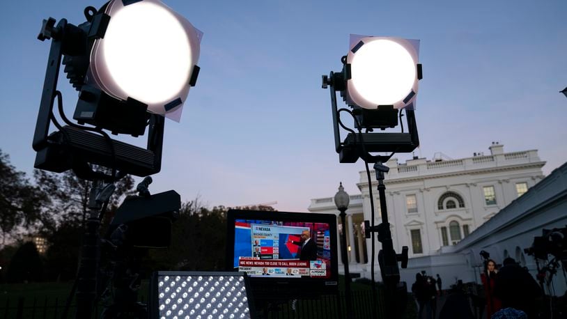 FILE - Media organizations set up outside the White House, Friday, Nov. 6, 2020, in Washington. (AP Photo/Evan Vucci, File)