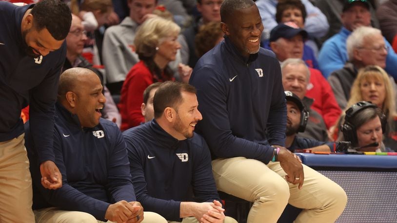 Dayton's Anthony Grant smiles on the bench during the final minutes of a victory against Rhode Island on Saturday, Jan. 20, 2024, at UD Arena. David Jablonski/Staff