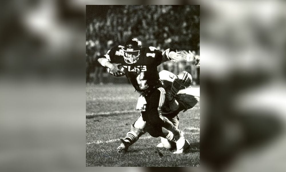 As a junior in 1986 (seen here against Fairmont), Herbstreit set a Centerville record with 317 passing yards in a game. That Elks team went 10-1 with a playoff appearance. DDN FILE