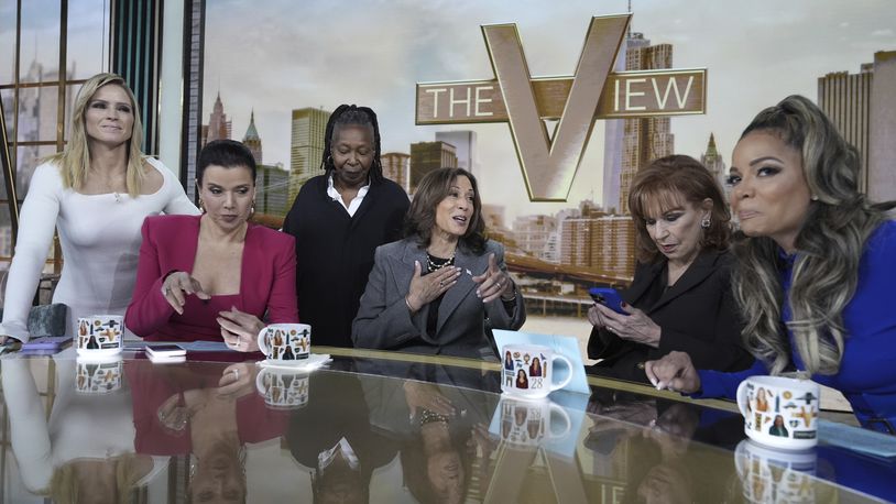 Democratic presidential nominee Vice President Kamala Harris chats with the hosts during a commercial break at The View, Tuesday, Oct. 8, 2024, in New York. (AP Photo/Jacquelyn Martin)