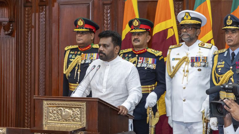 Commanders of the security forces stand behind as Sri Lanka's new president Anura Kumara Dissanayake, addresses a gathering after he was sworn in at the Sri Lankan President's Office in Colombo, Sri Lanka, Monday, Sept.23, 2024. (Sri Lankan President's Office via AP)