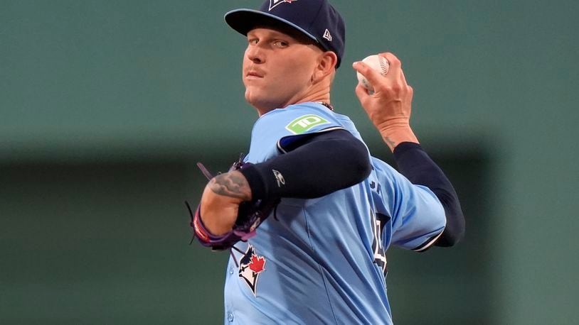 Toronto Blue Jays' Bowden Francis winds up for a pitch to a Boston Red Sox batter in the first inning of a baseball game Thursday, Aug. 29, 2024, in Boston. (AP Photo/Steven Senne)