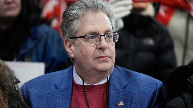 FILE - Matthew DePerno listens to Republican presidential candidate, former President Donald Trump, at a campaign rally in Waterford Township, Mich., Feb. 17, 2024. (AP Photo/Paul Sancya, File)