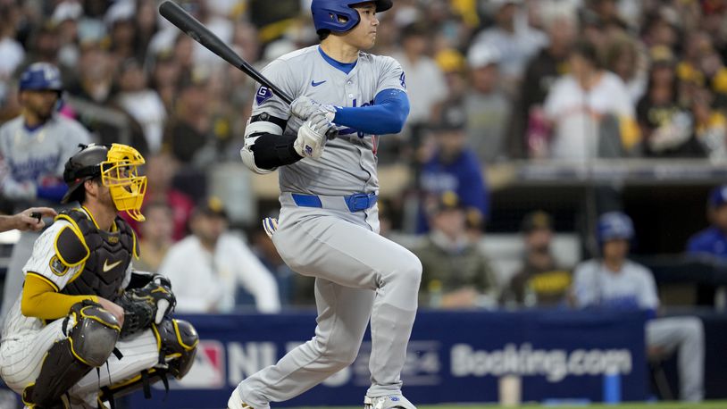 Los Angeles Dodgers' Shohei Ohtani grounds out during the first inning in Game 4 of a baseball NL Division Series against the San Diego Padres, Wednesday, Oct. 9, 2024, in San Diego. (AP Photo/Ashley Landis)