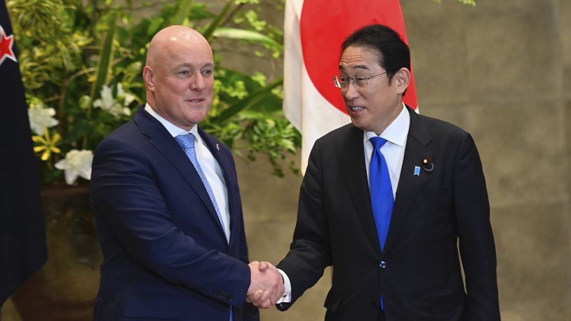 New Zealand Prime Minister Christopher Luxon, left, and Japan Prime Minister Fumio Kishida shake hands prior to their bilateral meeting at Kishida's office in Tokyo Wednesday, June 19, 2024. (David Mareuil/Pool Photo via AP)