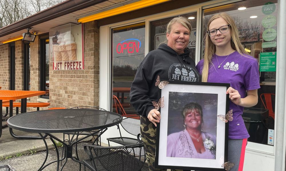 Jet Freeze, a Beavercreek staple since 1961, has reopened for the season. Pictured is Owner Brandi Bodey and her daughter, Makayla Mantia. They are holding a photo of Bodey's mom, Bonnie Mantia, who previously owned Jet Freeze. NATALIE JONES/STAFF