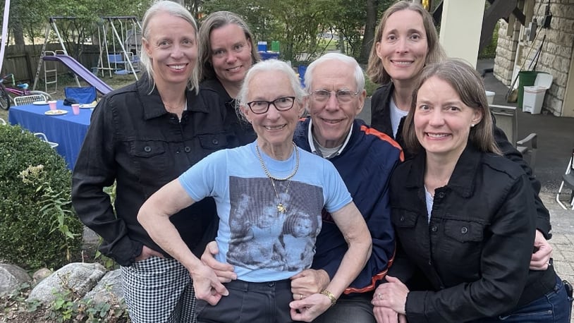 The Dedden quadruplets are seen in birth order from left to right: Katy Deddens Dalrymple, Patty Deddens,  Molly Deddens Blumer. Amy Deddens Carter with Ruth and Bob Deddens in the middle. Ruth is wearing a shirt that has a photo of the siblings when they were younger. Bob had it made at a fair from a photo he had in his wallet when the quads were toddlers, and Ruth still has the short. CHARLIE BLUMER/CONTRIBUTED