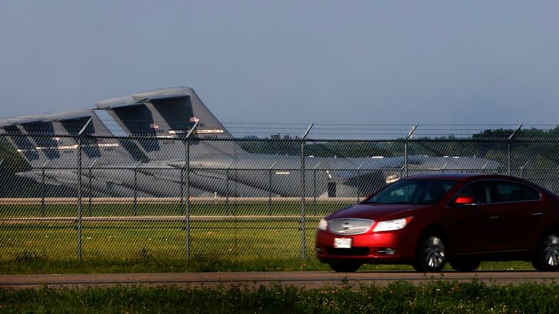 A car drives by Wright Patterson Air Force Base Wednesday, July 24, 2024. U.S. Sen. Sherrod Brown is proposing legislation to protect U.S. national security facilities and critical infrastructure by prohibiting Internet-connected vehicles produced in or controlled by China and other adversaries. MARSHALL GORBY\STAFF