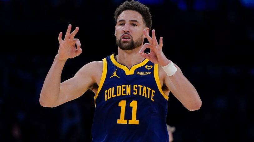 FILE - Golden State Warriors guard Klay Thompson gestures after making a 3-point basket against the Los Angeles Lakers during the second half of an NBA basketball game Tuesday, April 9, 2024, in Los Angeles. Klay Thompson is moving on from the Golden State Warriors, with the four-time league champion agreeing to join the Western Conference champion Dallas Mavericks and change franchises for the first time in his 13-year NBA career, two people with knowledge of the decision said Monday, July 1, 2024.(AP Photo/Ryan Sun)