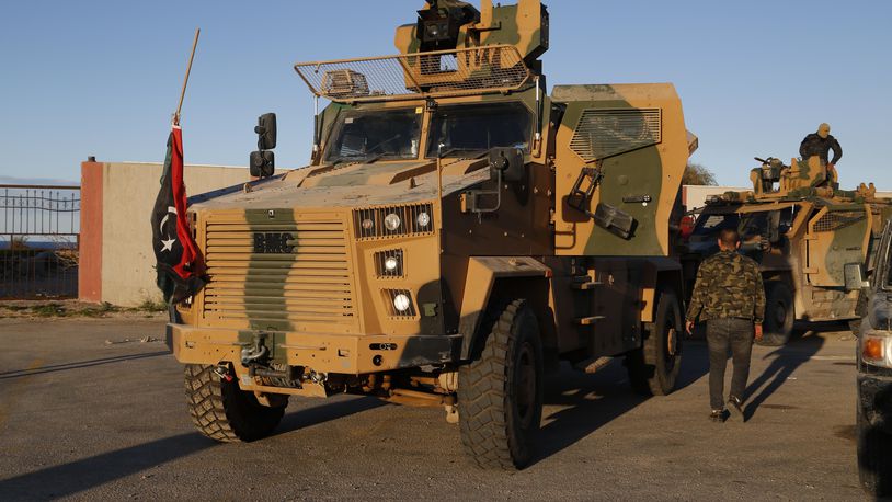 FILE - Forces loyal to the UN appointed interim prime minister Abdul Hamid Dbeibah arrive from Misrata to Tripoli in show of support Saturday, Feb. 12, 2022. (AP Photo/Yousef Murad, File)