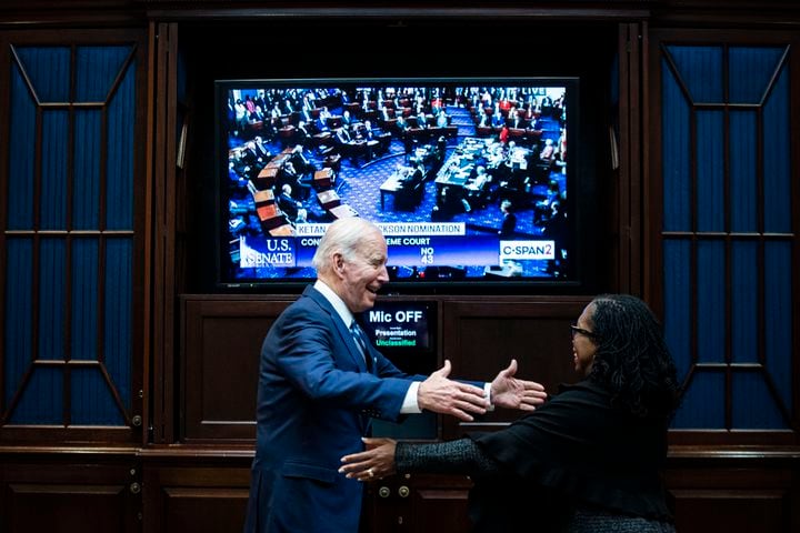 President Joe Biden and Judge Ketanji Brown Jackson watch as the Senate votes to confirm Jackson to the Supreme Court, from the Rosevelt Room of the White House in Washington on April 7, 2022. (Al Drago/The New York Times)