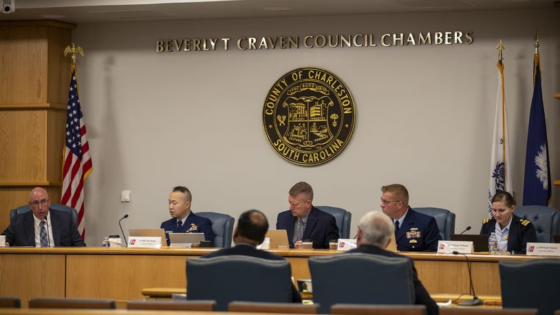 Members of the Coast Guard's Titan Submersible Marine Board of Investigation listen during the formal hearing inside the Charleston County Council Chambers, Monday, Sept. 23, 2024, in North Charleston, S.C. (Laura Bilson/The Post And Courier via AP, Pool)