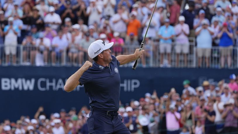 Keegan Bradley celebrates on the 18th green after winning the BMW Championship golf event at Castle Pines Golf Club, Sunday, Aug. 25, 2024, in Castle Rock, Colo. (AP Photo/Matt York)