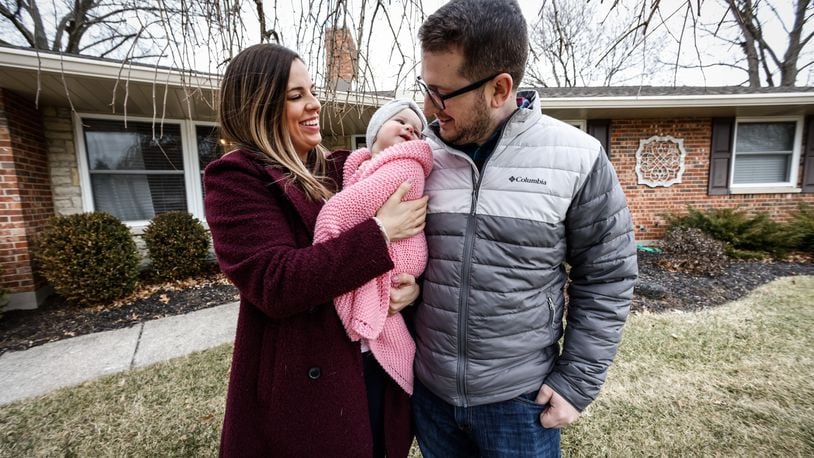 Steve and Kaitlen Gerace and their daughter, Gemma bought their house in Kettering four months ago. The couple said it is a challenge to find a home in Dayton's sellers'  market, but added equity in the house they sold. JIM NOELKER/STAFF