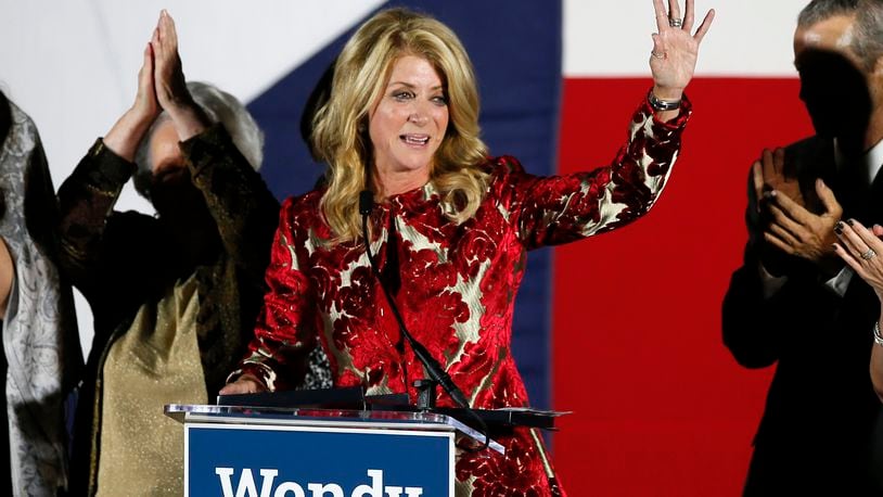 FILE - Then-Texas Democratic gubernatorial candidate Wendy Davis waves to supporters after making her concession speech, Nov. 4, 2014, in Fort Worth, Texas. (AP Photo/Tony Gutierrez, File)