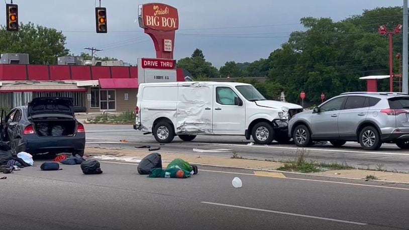 A police pursuit involving a stolen car that fled from police Friday afternoon, June 23, 2023, ended in a three-vehicle injury crash at North Springboro Pike and South Dixie Avenue in Moraine. JIM NOELKER/STAFF