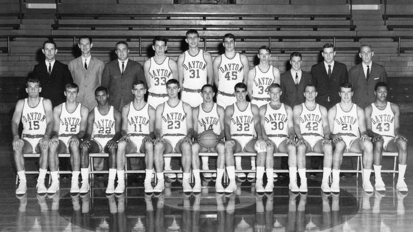 The 1967 University of Dayton basketball team. First Row, From Left: John Rohm, Rich Fox, Rudy Waterman, John Samanich, Gene Klaus, Dennis Papp, Dave Inderrieden, Bob Hooper, Don May, Glinder Torain.
Second Row, From Left: Don Donoher, Head Coach ; Chuck Grigsby and Chuck Izor, Assistant Coaches; Dan Sadlier, Dan Obrovac, Ned Sharpenter, Tom Heckman, Managers Joe Emmerick and Dave Borchers, Tom Frericks, Athletic Director.