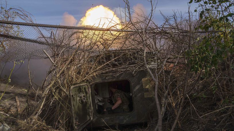 Ukrainian serviceman of 56th brigade fire by self-propelled artillery towards Russian positions at the frontline on Chasiv Yar direction, Donetsk region, Ukraine, Sept. 27, 2024. (AP Photo/Evgeniy Maloletka)