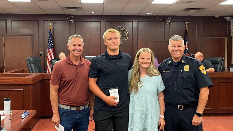 Franklin Public Works Director Steve Inman (far left) and Franklin Fire Chief Daniel Stitzel (far right) flank Jordan Milligan and Olivia DeHart, who were presented with valor awards Monday night. CONTRIBUTED