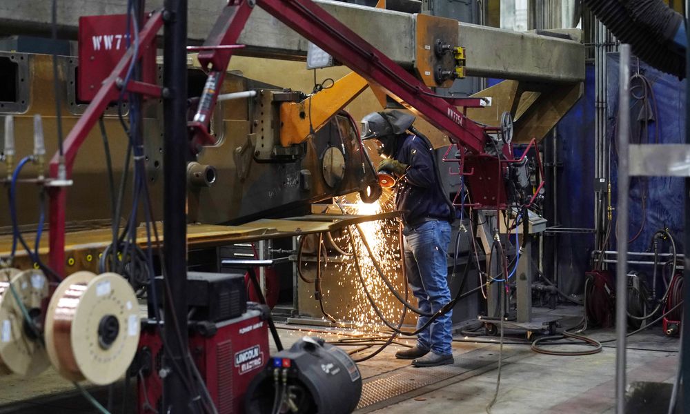 A worker grinds a weld on the latest version of the M1A2 Abrams main battle tank being built at the Joint Systems Manufacturing Center, Thursday, Feb. 16, 2023, in Lima, Ohio. (AP Photo/Carlos Osorio)