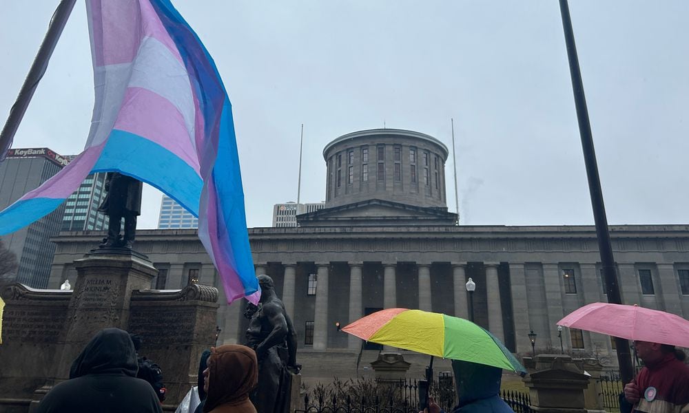 A group of protestors gathered outside the Ohio Statehouse on Wednesday, Jan. 24, 2024, to voice displeasure of the Senate's likely override of Gov. Mike DeWine's veto on a bill that would bar transgender minors from undergoing gender affirming care. AVERY KREEMER/STAFF