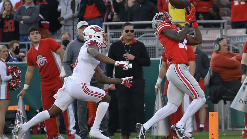 Ohio State wide receiver Marvin Harrison Jr., right, catches a touchdown during the first half in the Rose Bowl NCAA college football game against Utah Saturday, Jan. 1, 2022, in Pasadena, Calif. (AP Photo/John McCoy)