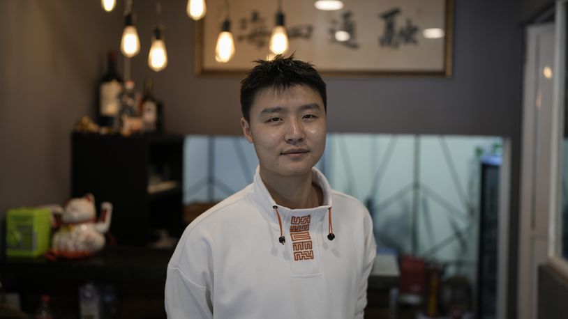 Owner Duan Fan poses in his Chinese restaurant “Nueve y media,” in the Roma Sur neighborhood of Mexico City, Friday, July 5, 2024. (AP Photo/Eduardo Verdugo)