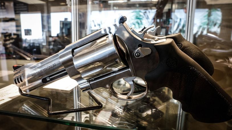 A handgun on display at a local store in Dayton. JIM NOELKER/STAFF