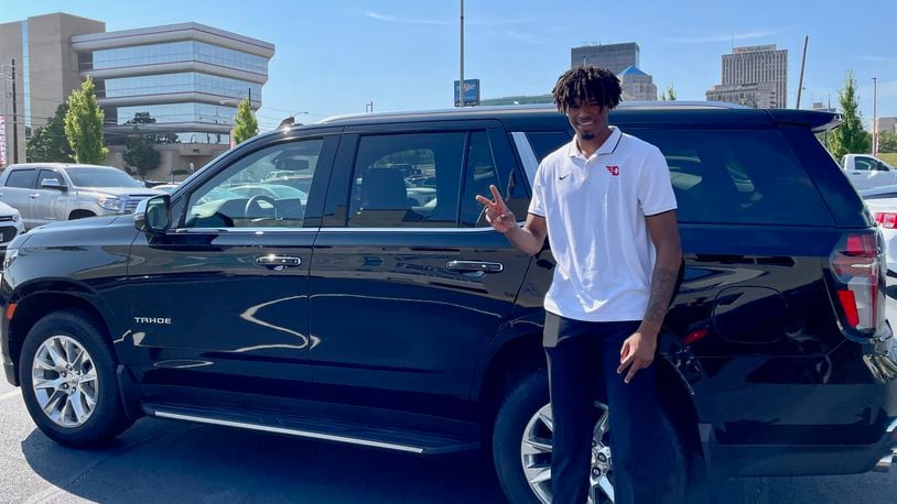 DaRon Holmes II poses for a photo on Friday, July 15, 2022, after receiving the keys to a Chevy Tahoe at White-Allen in Dayton. Photo courtesy of Matt Farrell