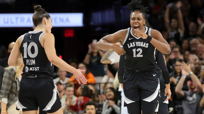 Las Vegas Aces guards Chelsea Gray (12) and Kelsey Plum (10) celebrate a play during the first half of an WNBA basketball game against the Seattle Storm Wednesday, June 19, 2024, in Las Vegas. (Steve Marcus/Las Vegas Sun via AP)