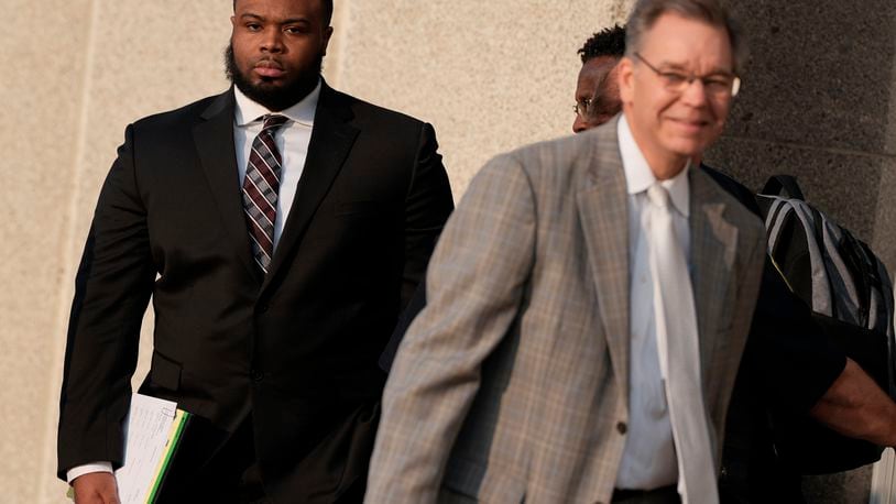 Former Memphis police officer Demetrius Haley, left, leaves the federal courthouse after the first day of jury selection of the trial in the Tyre Nichols case Monday, Sept. 9, 2024, in Memphis, Tenn. (AP Photo/George Walker IV)