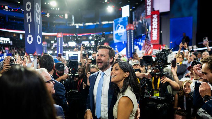 Sen. JD Vance, R-Ohio, arrives on the floor with his wife, Usha, on the first day of the Republican National Convention, at the Fiserv Forum in Milwaukee, Wis., on Monday, July 15, 2024. Former President Donald Trump’s decision to pick Vance as his running mate signals his concern for the future of his MAGA movement. (Doug Mills/The New York Times)