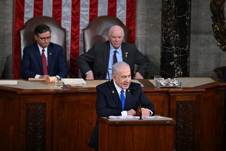 
                        Prime Minister Benjamin Netanyahu of Israel speaks to a joint session of Congress at the Capitol in Washington on Wednesday, July 24, 2024, as House Speaker Mike Johnson (R-La.), left, and Sen. Ben Cardin (D-Md.) look on. (Kenny Holston/The New York Times)
                      